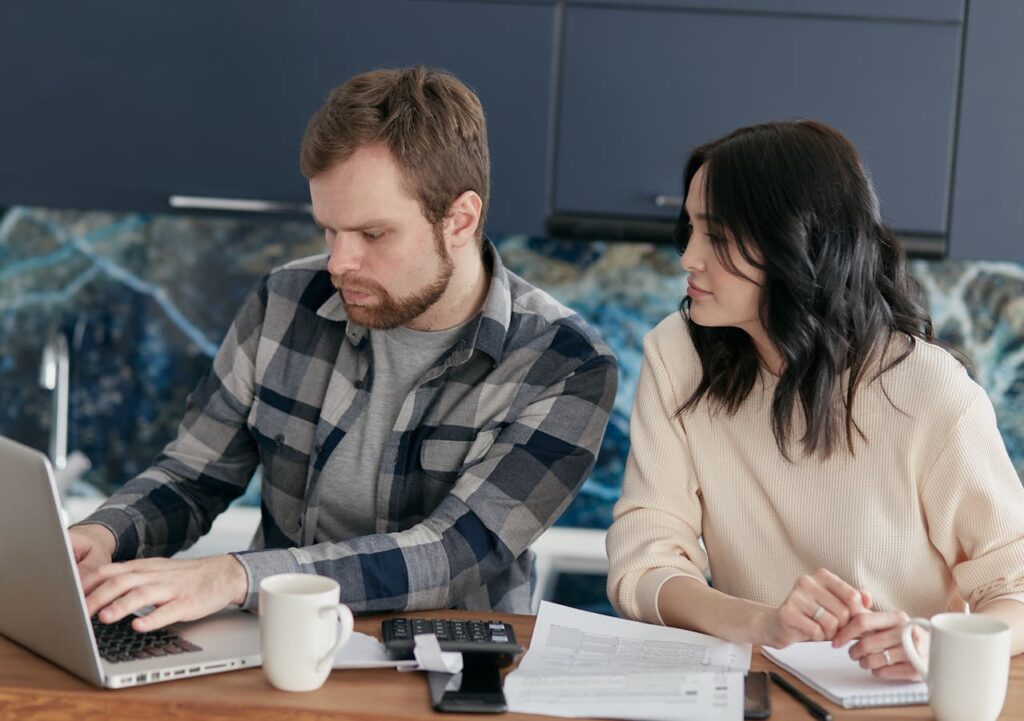 couple looking at health insurance online. 