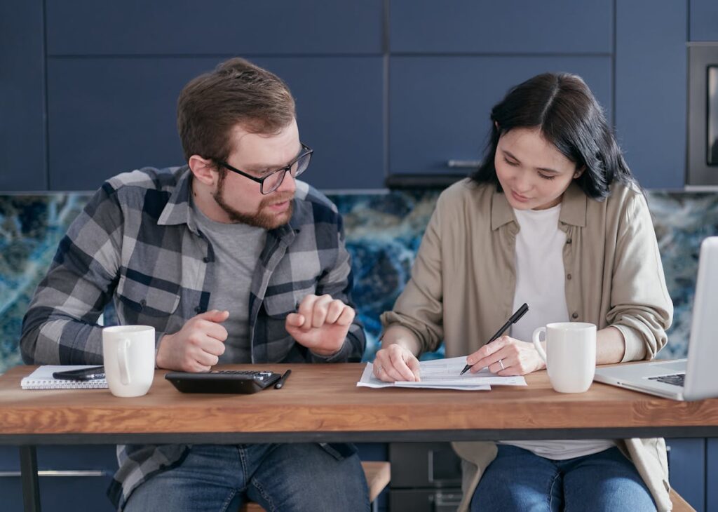 Couple looking at health insurance policy documents